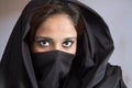 Young Muslim lady in black cloak veil hijaab