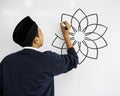 Young Muslim man writing on a whiteboard Royalty Free Stock Photo