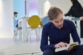 Young muslim man reading Quran during Ramadan