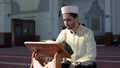 Muslim cleric reading quran