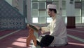 Muslim cleric reading quran