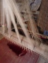 Young muslim man runs a loom