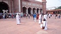 Young muslim men taking photos at Jama Masjid