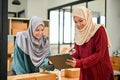Young Muslim online start up business team working together, checking order with tablet Royalty Free Stock Photo