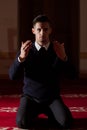 Young muslim pray in mosque Royalty Free Stock Photo