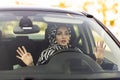 Young muslim woman driving a car shocked about to have traffic accident Royalty Free Stock Photo