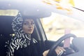 Young muslim woman driving a car shocked about to have traffic accident Royalty Free Stock Photo