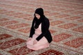 Young muslim woman praying