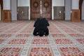 Young muslim woman praying