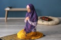 Young Muslim woman praying at home Royalty Free Stock Photo