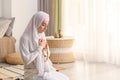 Young Muslim woman praying at home Royalty Free Stock Photo