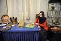 Young muslim woman presents traditional Uzbek handmades during celebrating Islamic holiday Mawlid