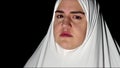 Young Muslim woman in White prayer clothes and headscarf