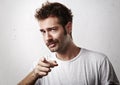 Young mustached man pointing towards the camera Royalty Free Stock Photo