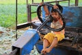 Young Myanmar child play to drive