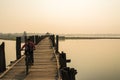 Young myanmar riding bicycle on U Bein bridge