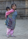 Young Naga Tribal Girl carrying her sibling on her back at Khonoma Village on 4th Dec 2016 at Khonoma Village,nagaland