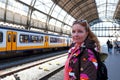 Young native dutch woman waiting for the train in Amsterdam Netherlands