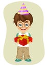 Young nerd boy with party hat holding birthday gift