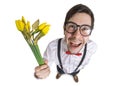 Young nerdy man holds blossoming yellow flowers in hand at first date. Isolated on white background