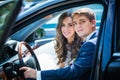 Young newlyweds inside a car Royalty Free Stock Photo