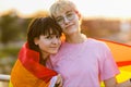 Portrait of a gender fluid couple wearing rainbow flag Royalty Free Stock Photo