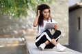 Young North African woman with looking at her digital tablet out Royalty Free Stock Photo