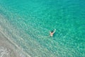 Young nude beautiful, sexy woman with naked breast lying on sea, ocean water. Summer. View from above. Top view, copter. Royalty Free Stock Photo