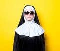 Young nun with sunglasses