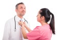 Young nurse adjusting tie of handsome medic