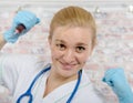 Young nurse with a big syringe Royalty Free Stock Photo
