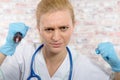 Young nurse with a big syringe Royalty Free Stock Photo
