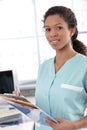 Young nurse with case sheets Royalty Free Stock Photo