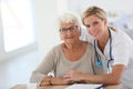 Young nurse with elderly woman