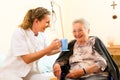 Young nurse and female senior in nursing home Royalty Free Stock Photo