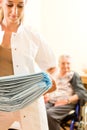 Young nurse and female senior in nursing home