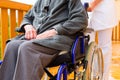 Young nurse and female senior in a wheel chair Royalty Free Stock Photo