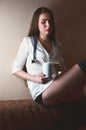 Young nurse girl sitting with coffee cup Royalty Free Stock Photo