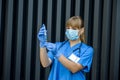 Young nurse holding vials medication and injection needle. Medical doctor picking up medication into syringe Royalty Free Stock Photo