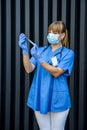 Young nurse holding vials medication and injection needle. Medical doctor picking up medication into syringe Royalty Free Stock Photo