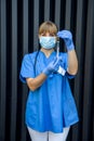 Young nurse holding vials medication and injection needle. Medical doctor picking up medication into syringe