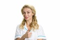 Young nurse showing thumb up. Royalty Free Stock Photo