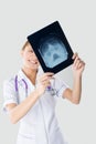 Young nurse studying the X-ray Royalty Free Stock Photo