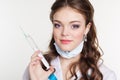 Young nurse with syringe on white background Royalty Free Stock Photo