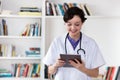 Young nurse working with digital tablet Royalty Free Stock Photo