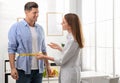 Young nutritionist measuring patient`s waist Royalty Free Stock Photo