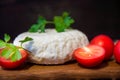 Young oak cheese cutting Board with tomatoes and parsley. Mozarella for pizzas and salads. Royalty Free Stock Photo