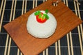 Young oak cheese cutting Board with tomatoes and parsley. Mozarella for pizzas and salads. Royalty Free Stock Photo