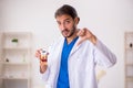 Young male odontologist working in the clinic Royalty Free Stock Photo