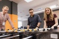 Young Office Workers Playing Table Soccer Royalty Free Stock Photo